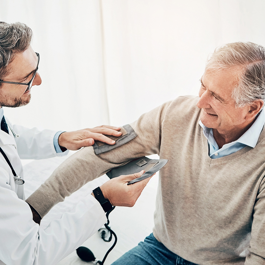 Doctor performing blood pressure check